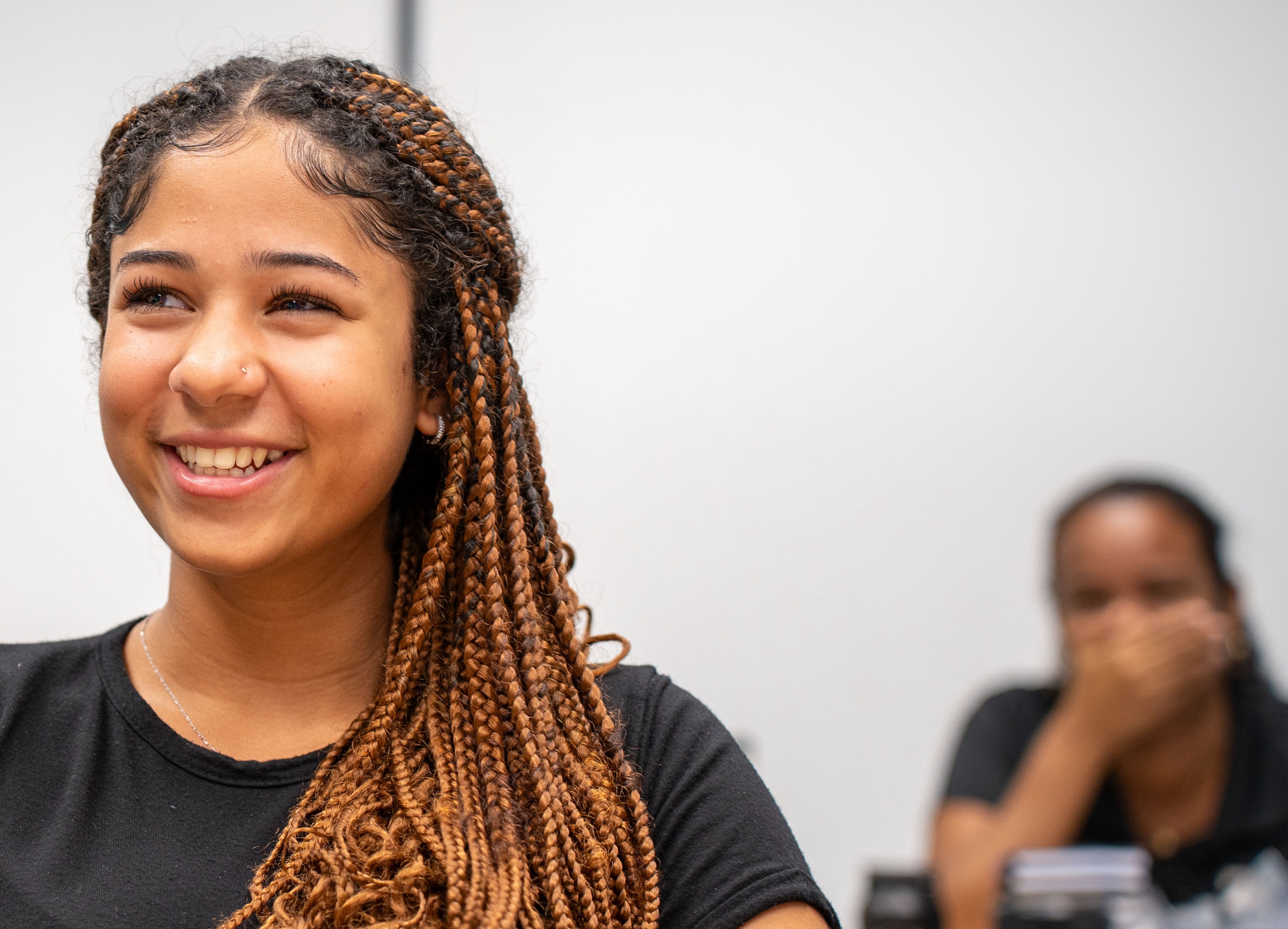 Scholarship panel featuring information and imagery related to Cayman National's educational support and opportunities.