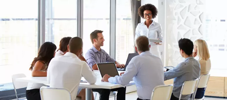 Business professionals discussing financial strategies in a modern office, symbolizing corporate account management and financial growth.