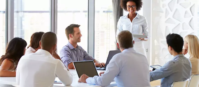 Business professionals in a meeting discussing financial strategies in a modern office